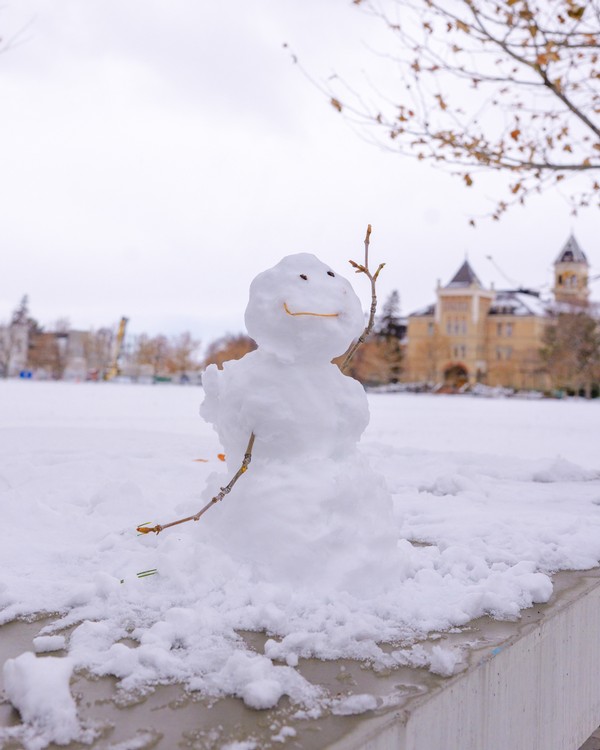 A little snowman on USU's Logan Campus appears to wave at the camera